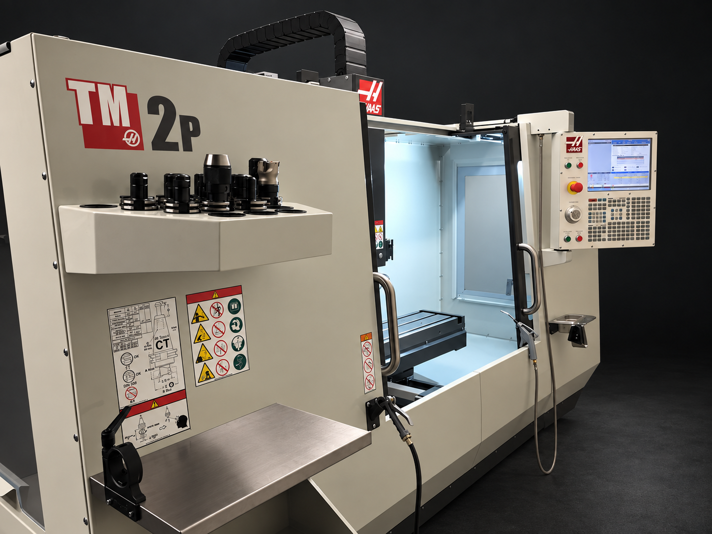 Haas TM-2P CNC milling machine with open work enclosure and control panel